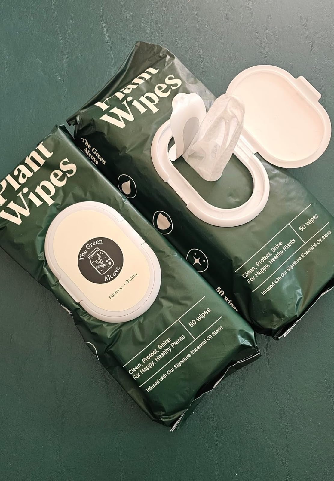 Two packs of works  wipes with unfastened  lid showing a wipe. Packaging highlights 