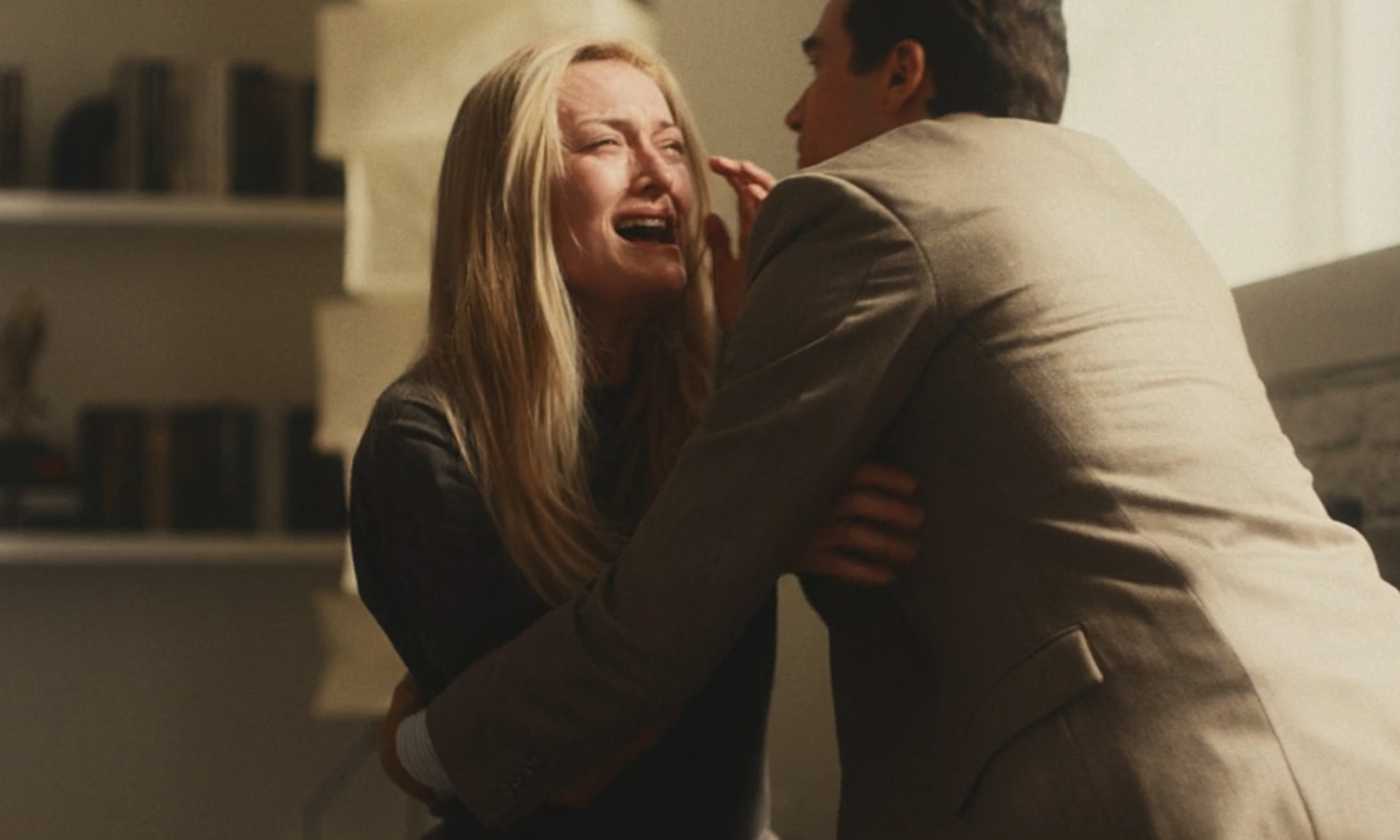 A melodramatic  country   with 2  characters interacting emotionally; 1  is crying intensely portion    being comforted by the other