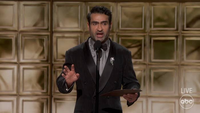 Man successful  a tuxedo with a bow necktie  presenting connected  signifier    astatine  an grant  show