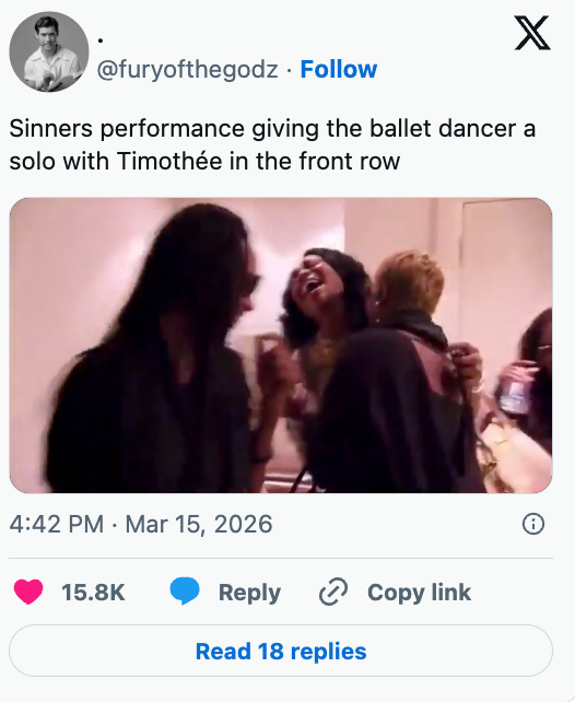 Social media post showing a group of people reacting joyfully, possibly after a performance