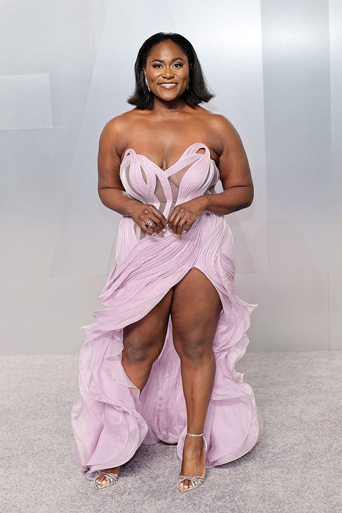 Person successful elegant flowing formal with intricate plan connected a carpeted event