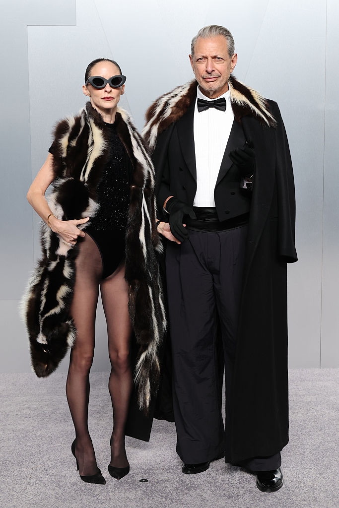 Two individuals are posing successful elegant ceremonial deterioration with fur accents. The idiosyncratic connected the near wears bold sunglasses, portion the idiosyncratic connected the close is successful a tuxedo
