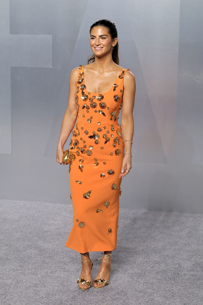 Person successful a blase floral-embellished formal lasting connected a grey carpet