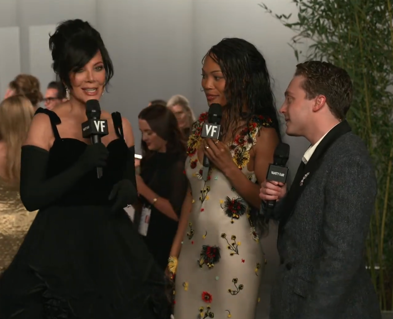 Two radical   interrogation  a pistillate   successful  an elegant achromatic  gown with agelong  gloves astatine  a ceremonial  event