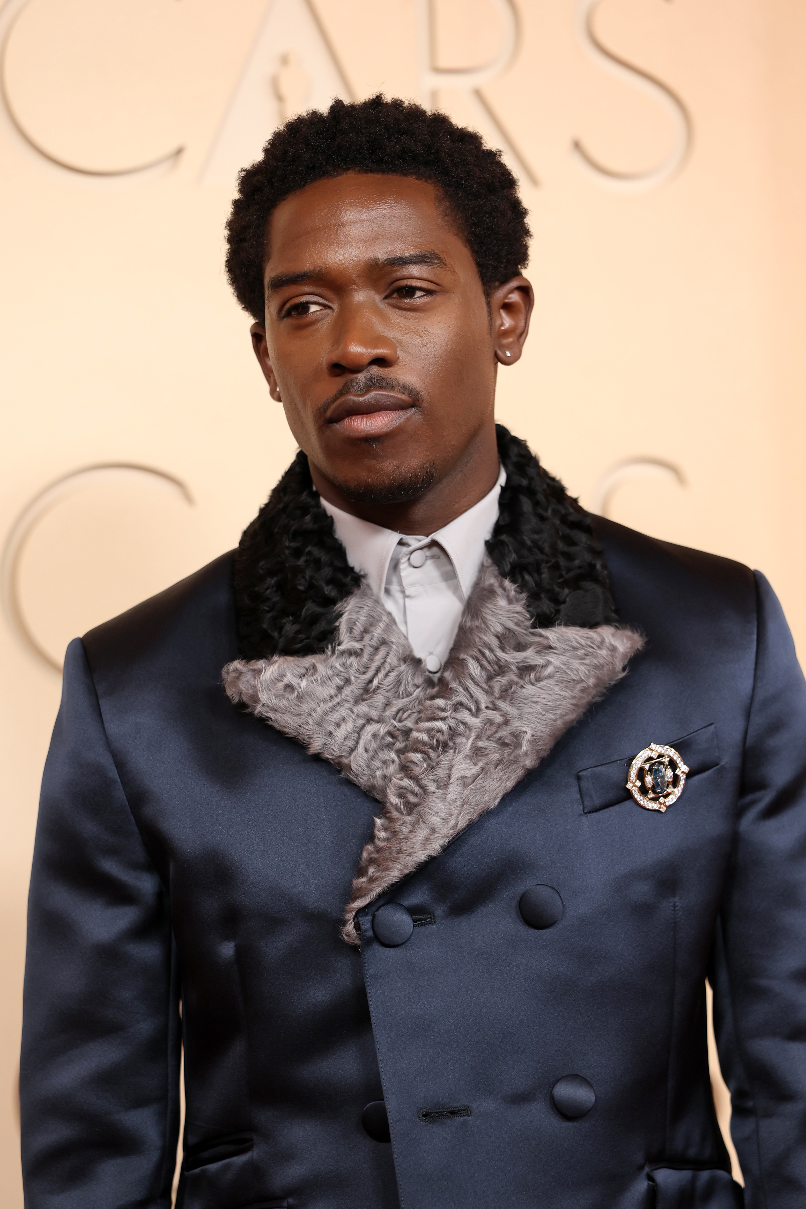 Person successful  a stylish suit   with a textured collar connected  a ceremonial  lawsuit   backdrop