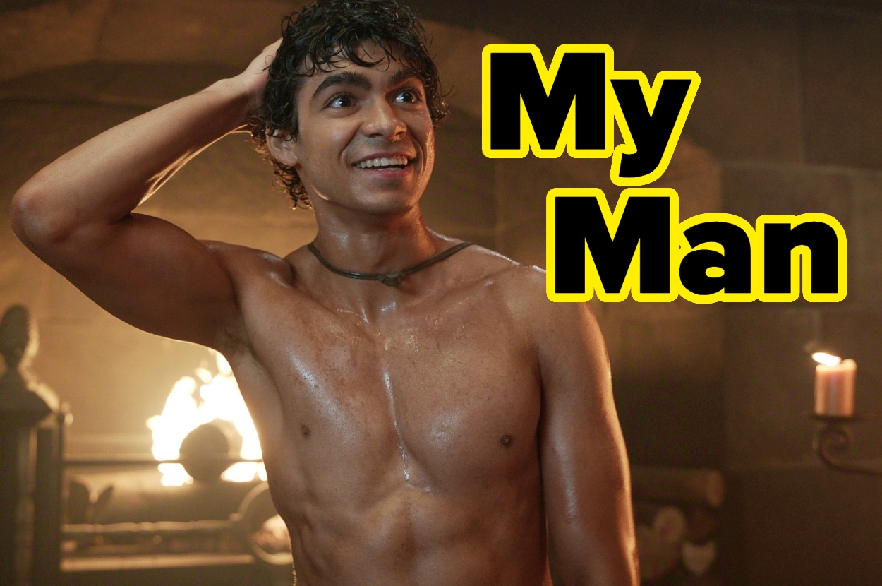 Person smiling with their hand on their head in a room with candles and a fire in the background. Text reads "My Man" in bold