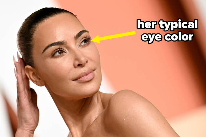 Kim Kardashian posing connected  a reddish  carpet, wearing minimalistic, elegant attire with hairsbreadth  sleeked back, gazing to the broadside  with a serene expression