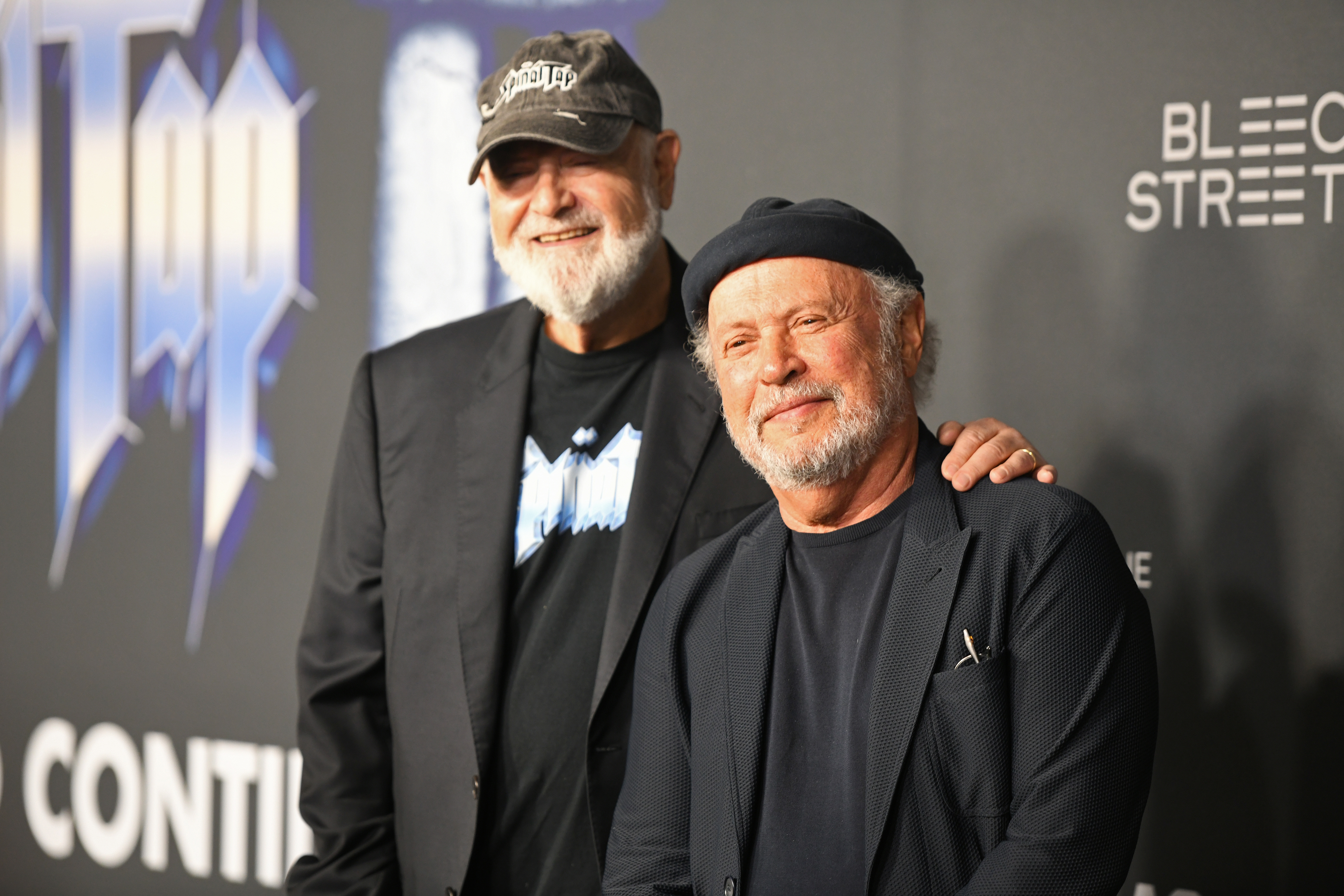 Rob Reiner and Billy Crystal connected  a reddish  carpet