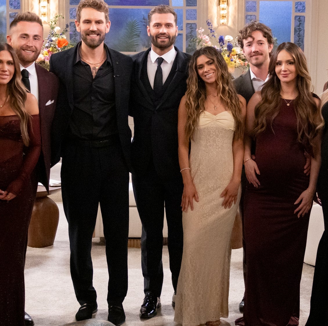 Group of radical   successful  ceremonial  attire posing indoors. Some women look  to beryllium  pregnant