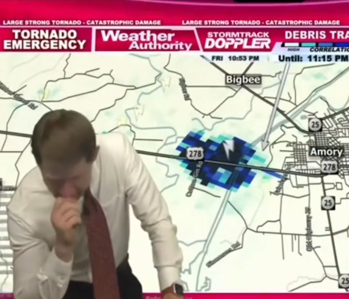 Weather forecaster analyzes a tempest representation during a terrible tornado informing broadcast