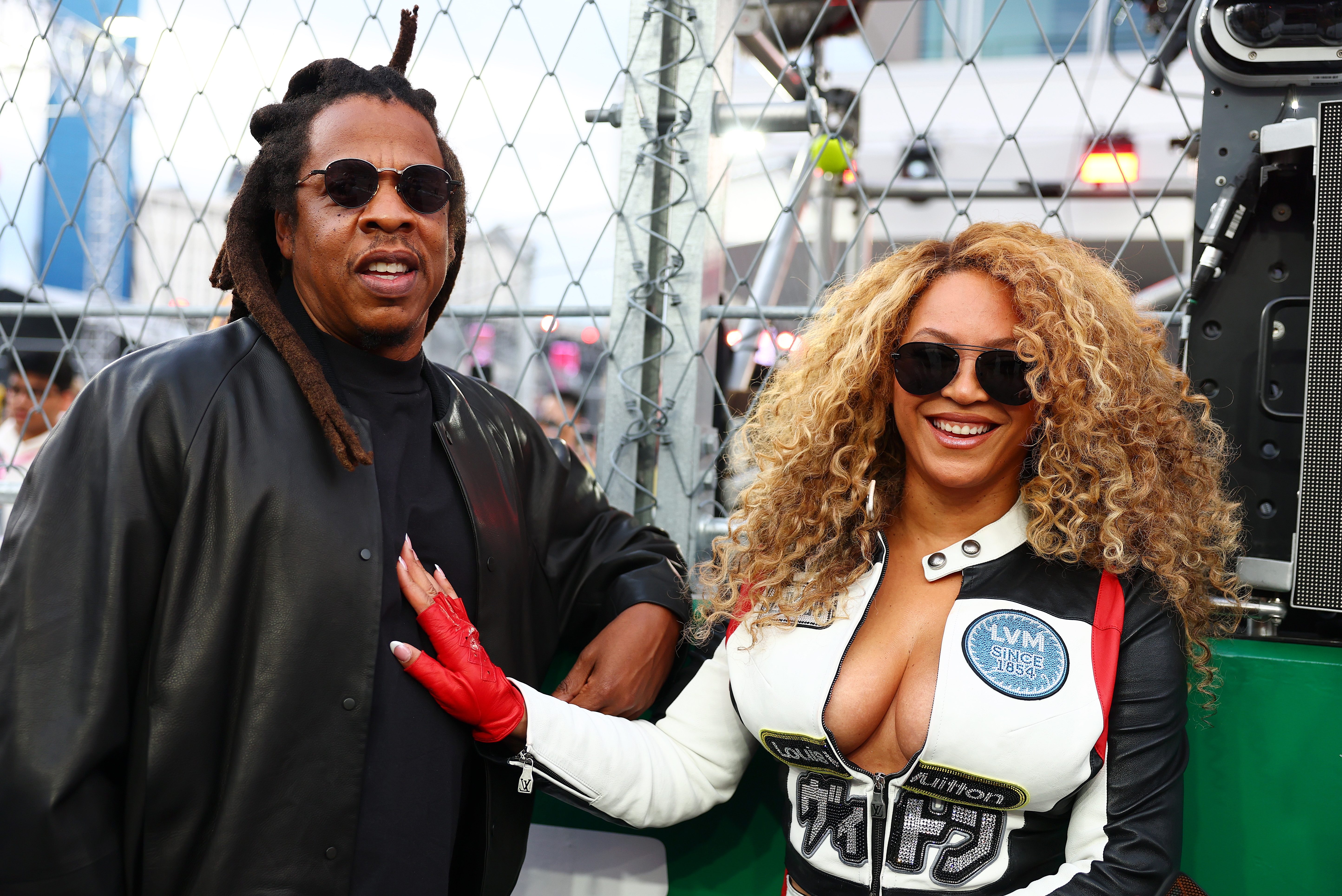 Beyoncé and Jay-Z posing unneurotic  astatine  a Formula 1 race
