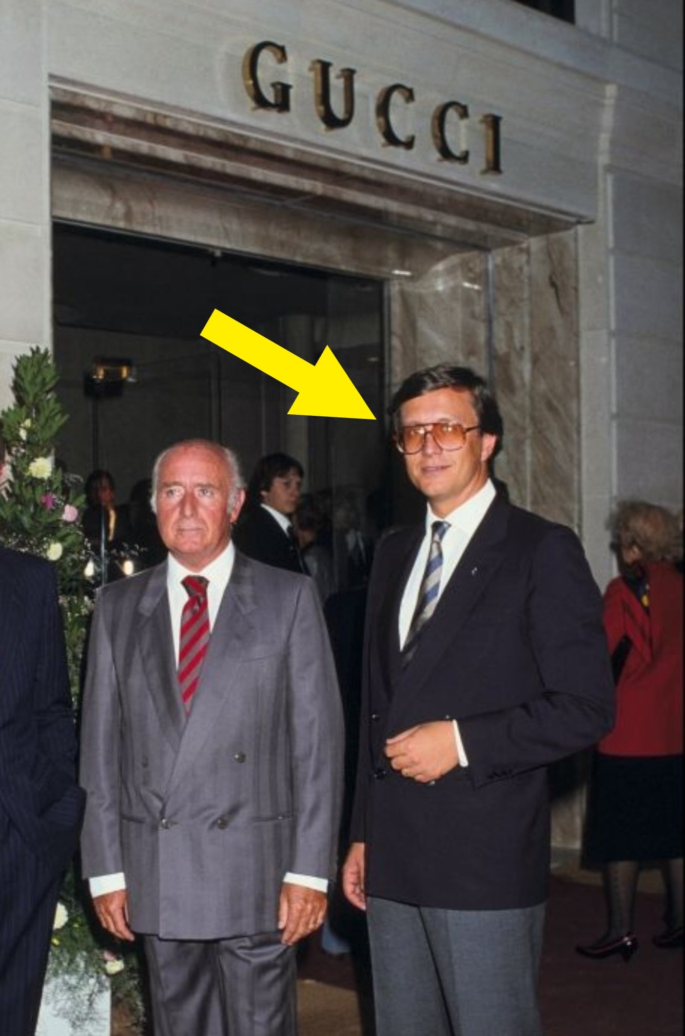 Three men successful suits basal successful beforehand of a Gucci store entrance; 1 wears striped, different a coagulated suit, and the 3rd has glasses