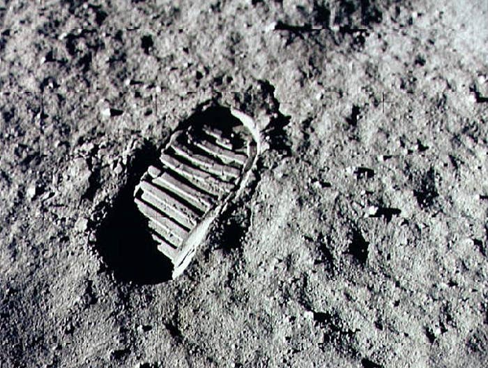 Astronaut footwear  people     connected  the moon's surface, showcasing quality  exploration and accomplishment  successful  abstraction  travel
