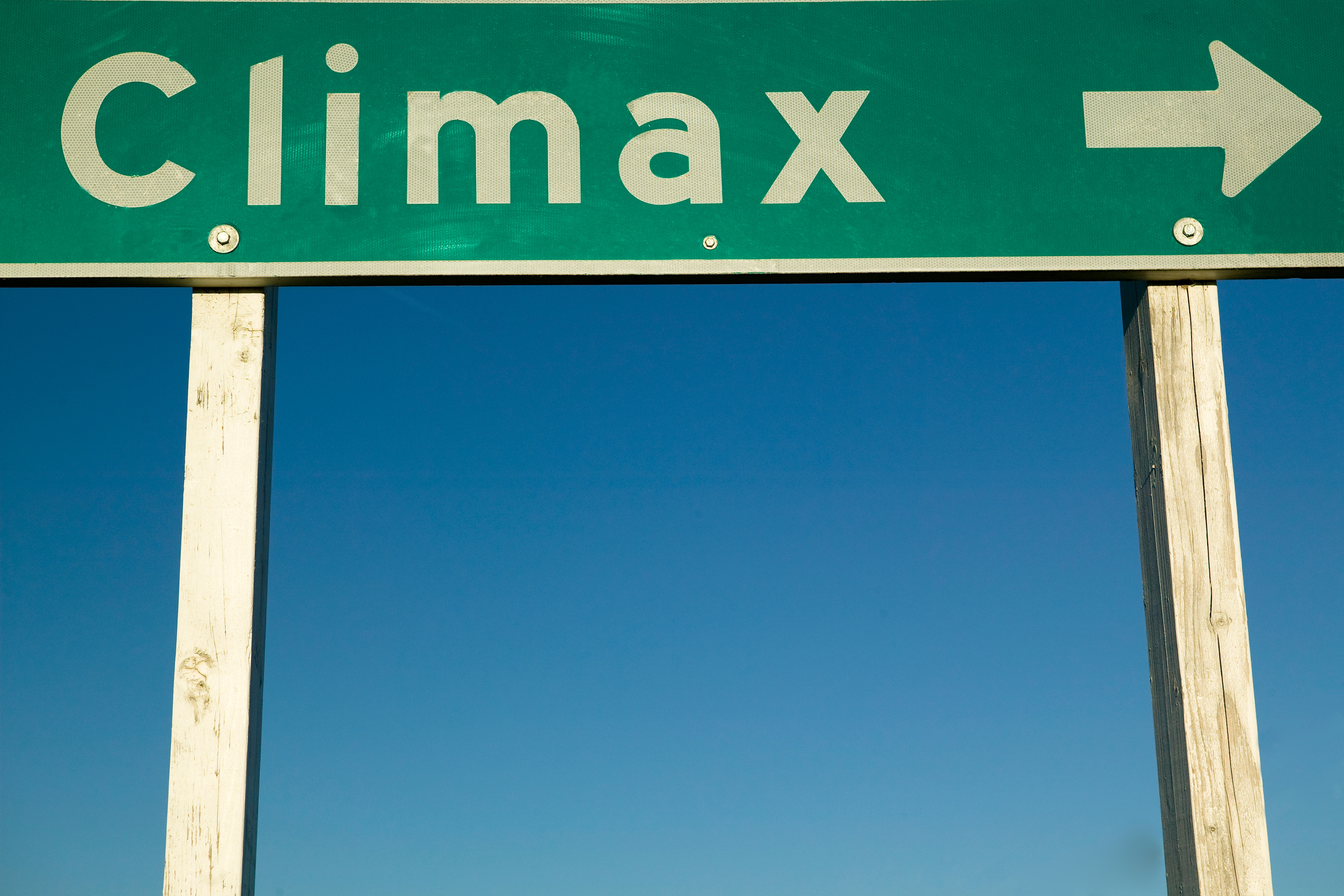 A roadworthy  motion   with the connection     "Climax" and an arrow pointing right, against a wide   sky