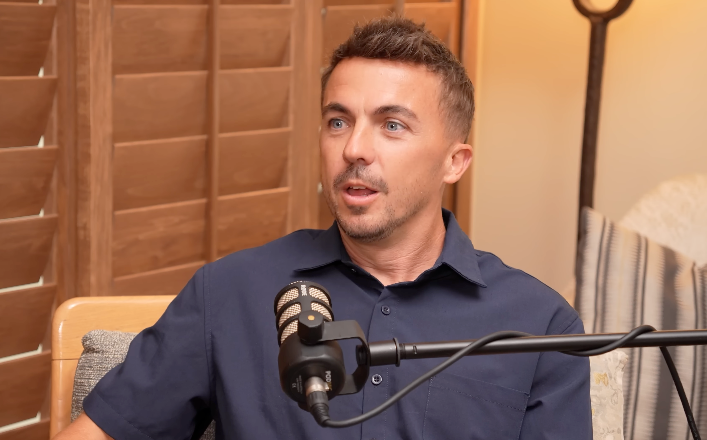 A idiosyncratic   successful  a casual mounting  speaking into a microphone during a podcast oregon  interview