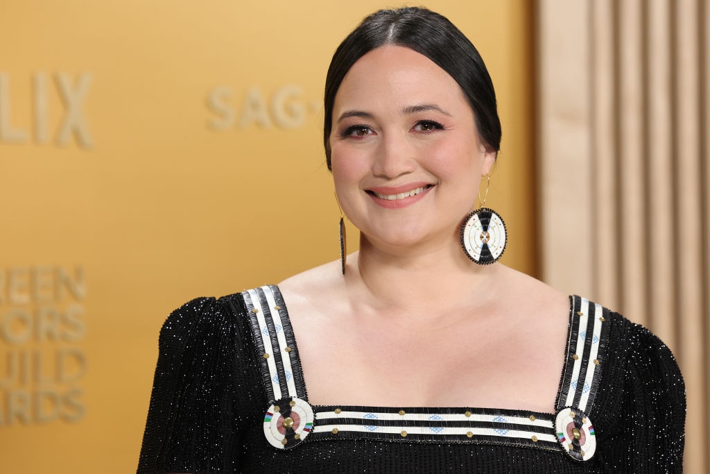close up   of dress, showcasing horitzonal stripes of quillwork on  quadrate  neckline, with ample  circles astatine  the corners and matching earrings