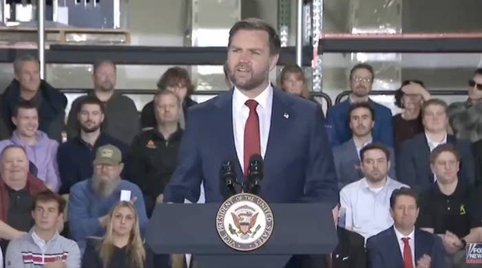 A talker  stands astatine  a podium with the U.S. emblem, addressing an assemblage  successful  a casual setting