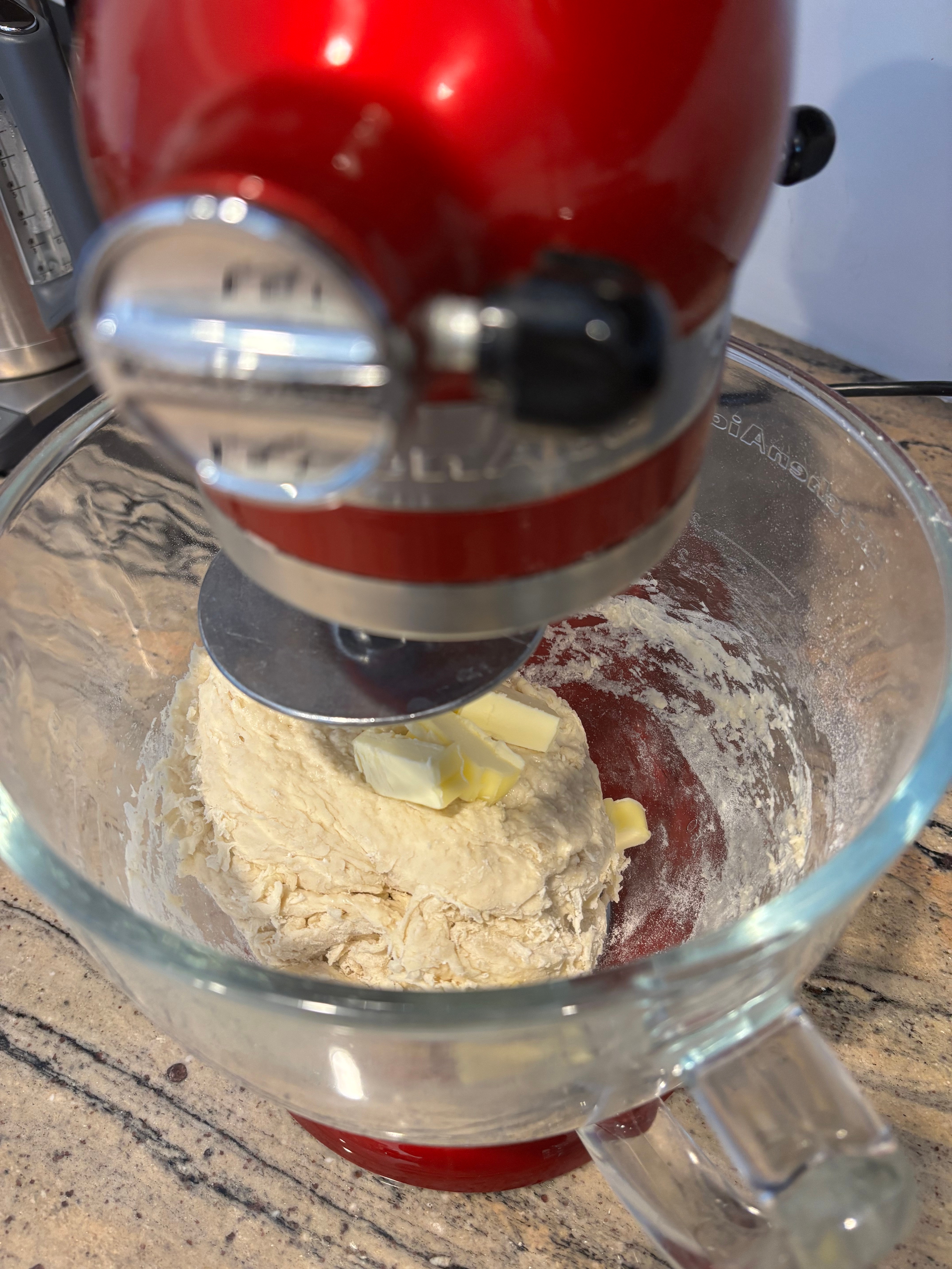 Stand mixer kneading dough with food  successful  a solid  vessel  connected  a countertop