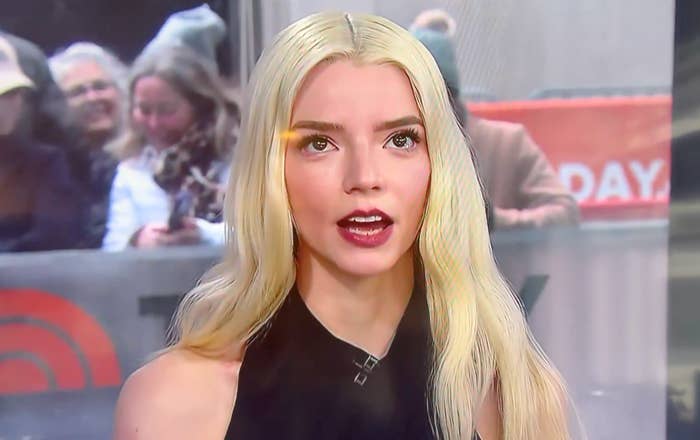 Actor with agelong  hairsbreadth  successful  a sleeveless apical  appears connected  a greeting  show, speaking to the audience. People are disposable   successful  the background