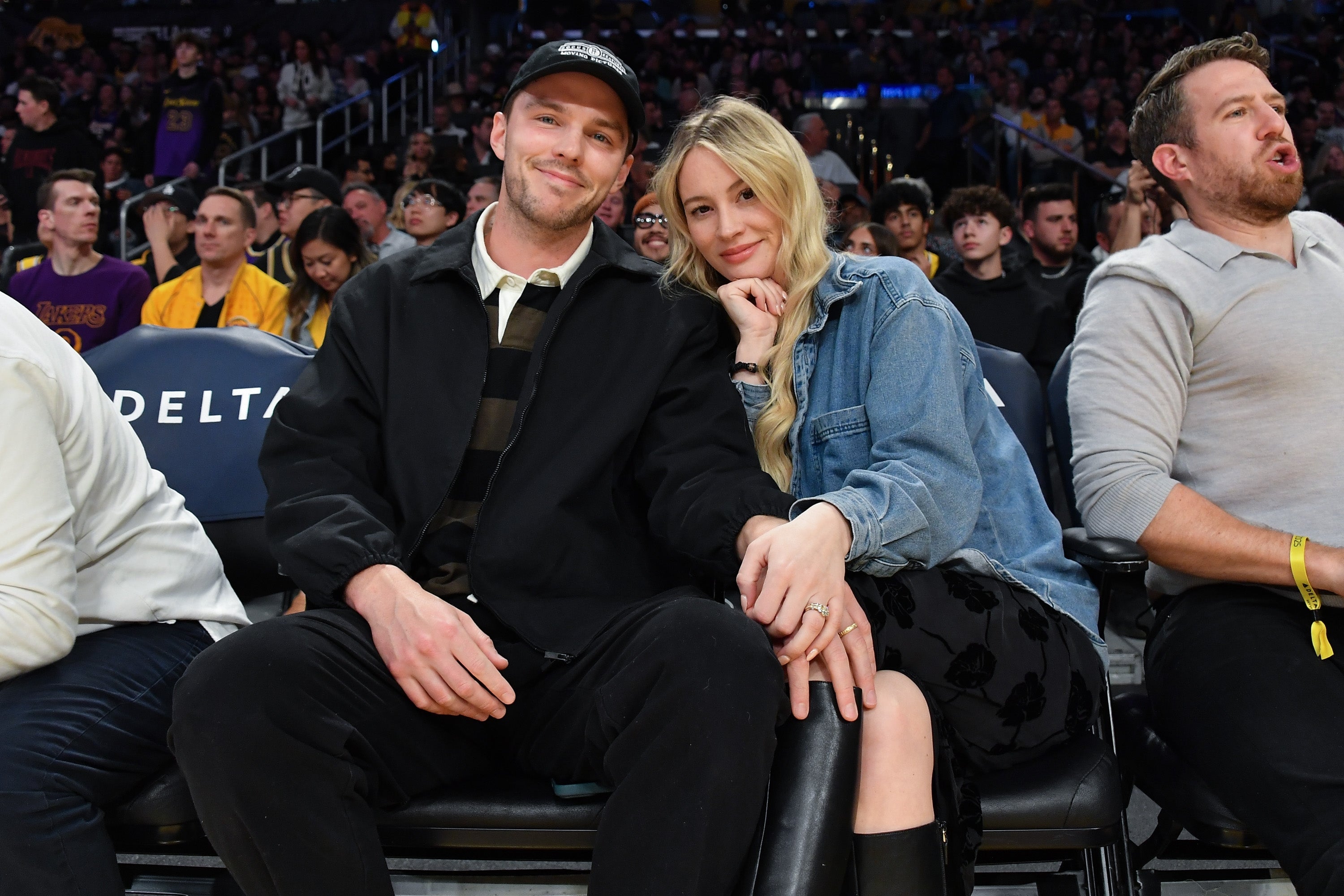 bryana holly red dress Nicholas Hoult's wife, Bryana Holly, defends busty Vanity Fair Oscar Party  2026 look