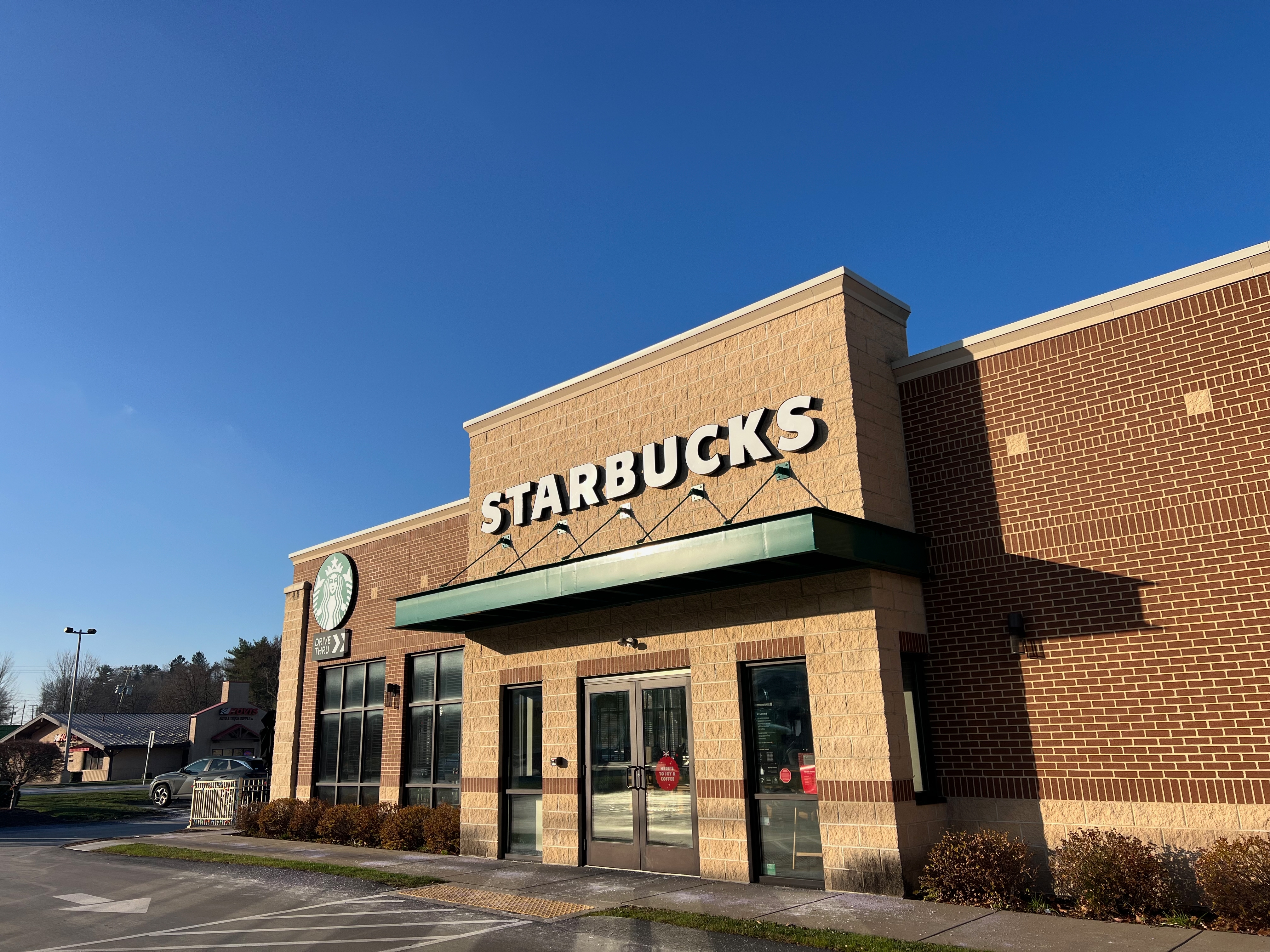Starbucks storefront connected a wide day, showcasing the logo and entrance, with nary disposable customers oregon activity