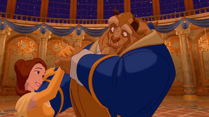 Belle and the Beast dance elegantly in a grand ballroom, showcasing their connection in a classic animated scene