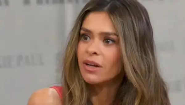 A idiosyncratic   with agelong  hairsbreadth  looks attentive and engaged during an interrogation  oregon  conversation