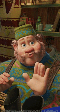 Animated character, burly with a beard, wearing a patterned sweater and cap, gesturing animatedly indoors. Appears in a film or TV show scene