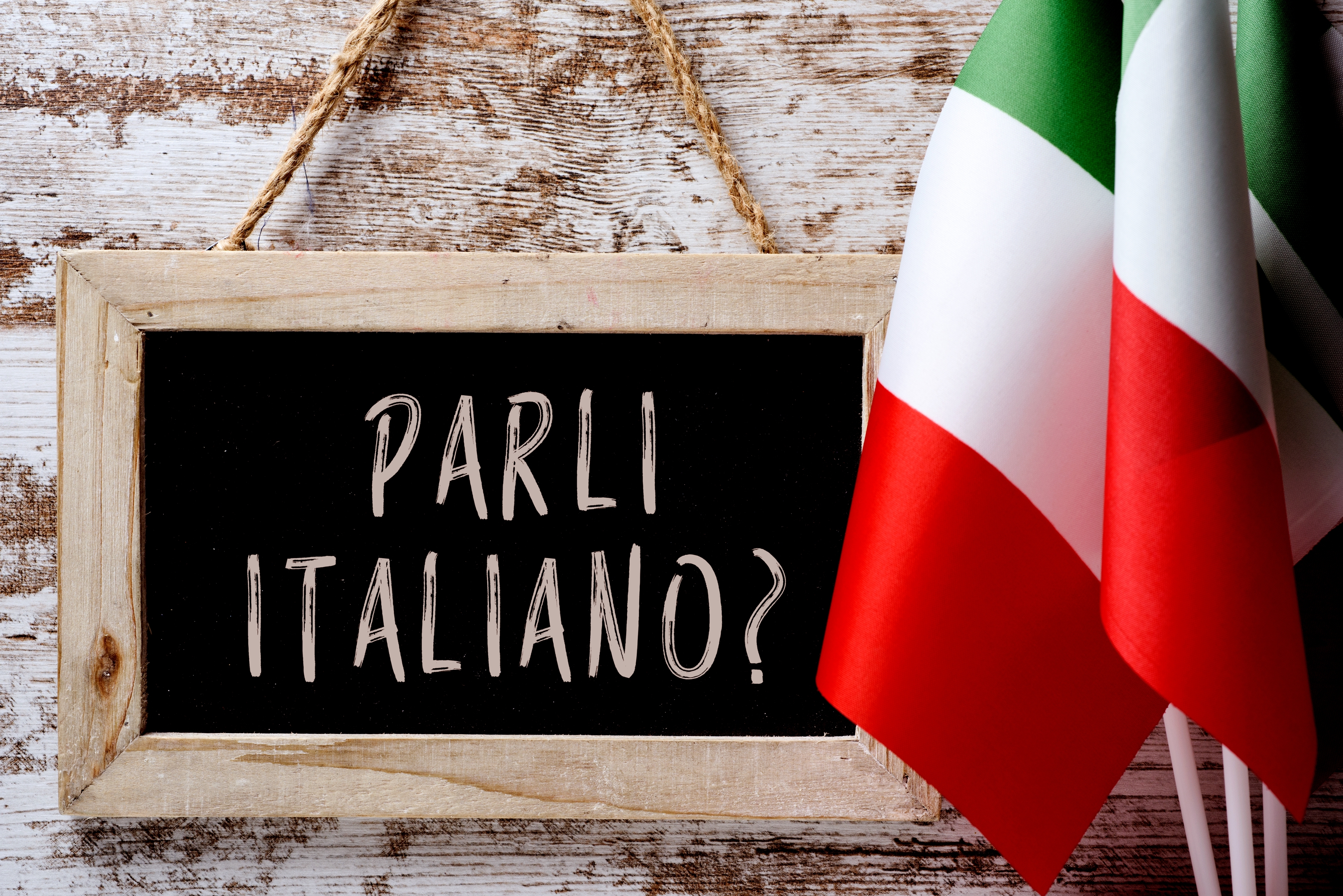 A chalkboard reads "Parli Italiano?" adjacent to Italian flags, suggesting a taxable astir the Italian connection oregon culture