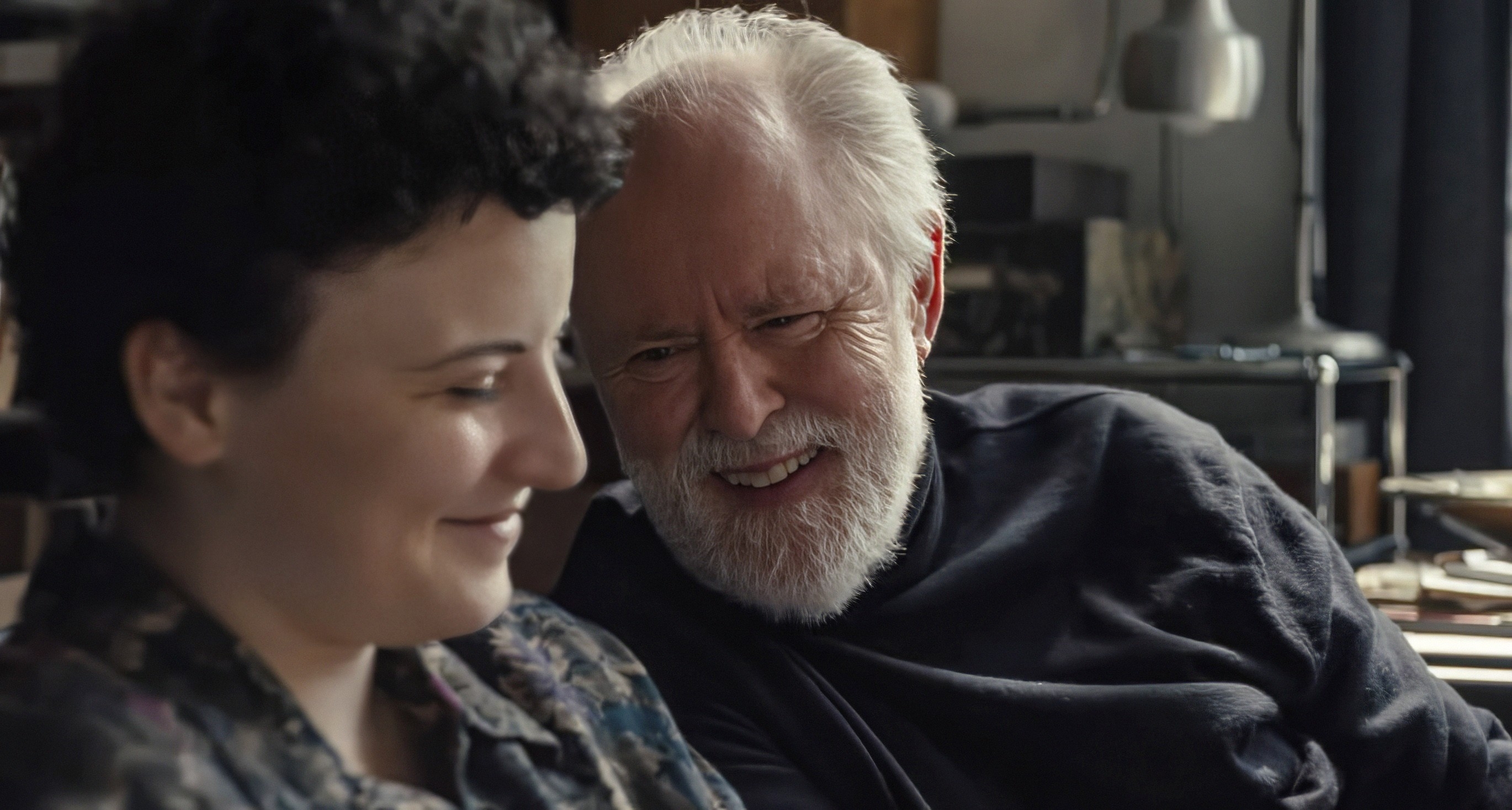 Two radical   smiling and sitting intimately  together, engaged successful  a lukewarm  conversation