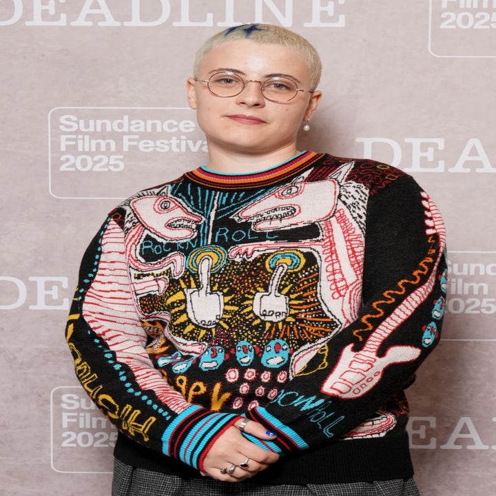 Person in patterned sweater and glasses at Sundance Film Festival 2025 event backdrop