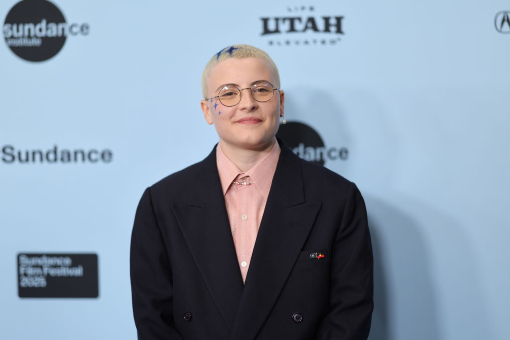 Person with abbreviated  hairsbreadth  successful  a suit   overgarment   and collared garment  astatine  Sundance Film Festival 2023 lawsuit   backdrop