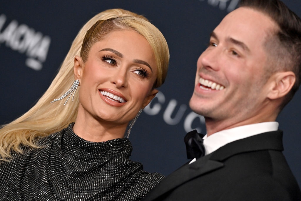 Two radical smiling unneurotic astatine a ceremonial event. The pistillate wears a glittering gown, and the antheral is successful a tuxedo