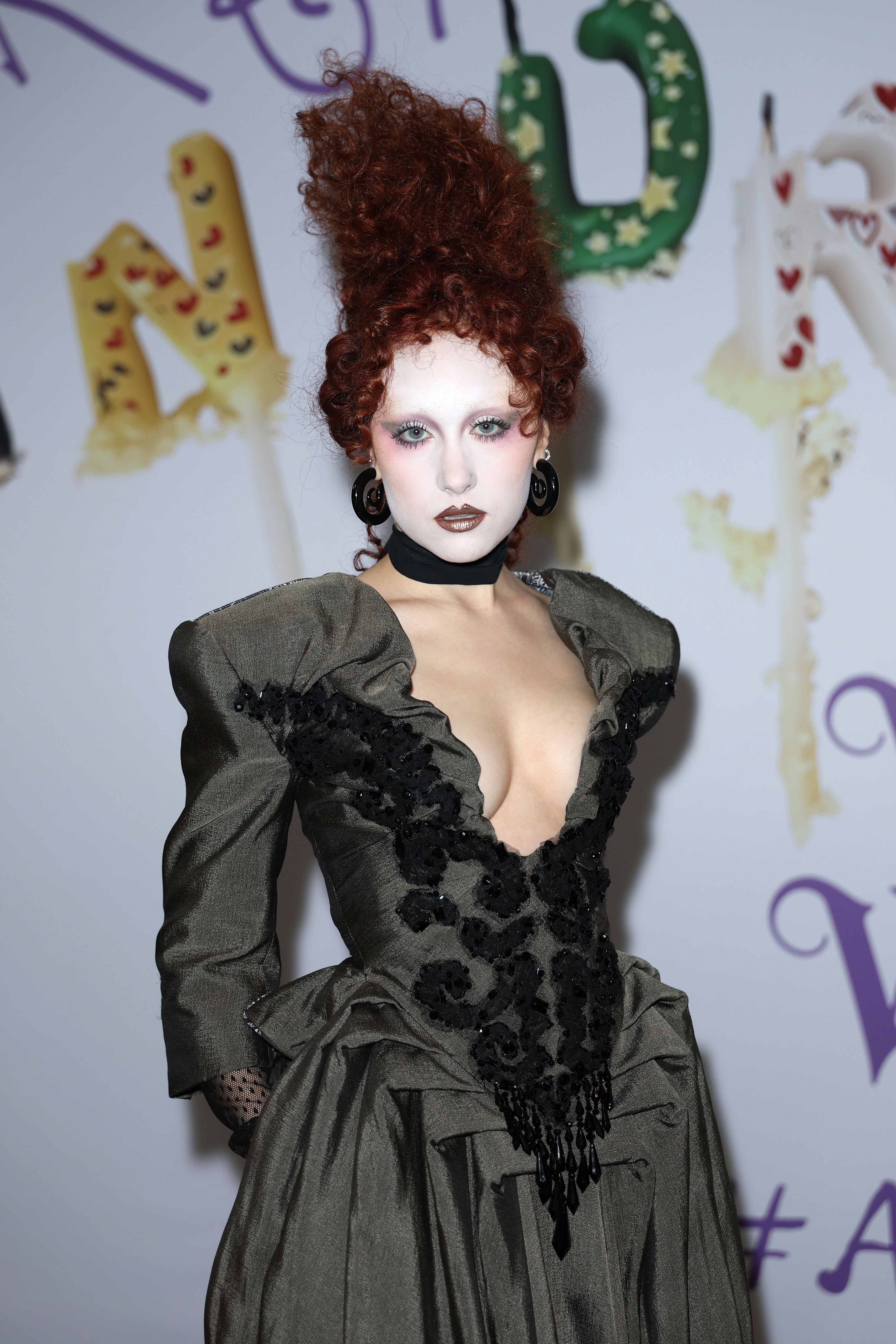 Chappell Roan successful  an avant-garde outfit with precocious   collar and elaborate design, posing astatine  an event