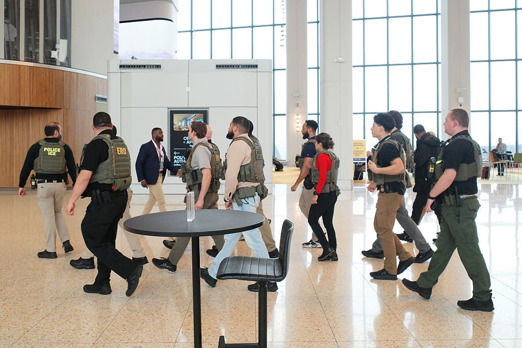 A radical of instrumentality enforcement officers successful tactical cogwheel locomotion done an airdrome terminal