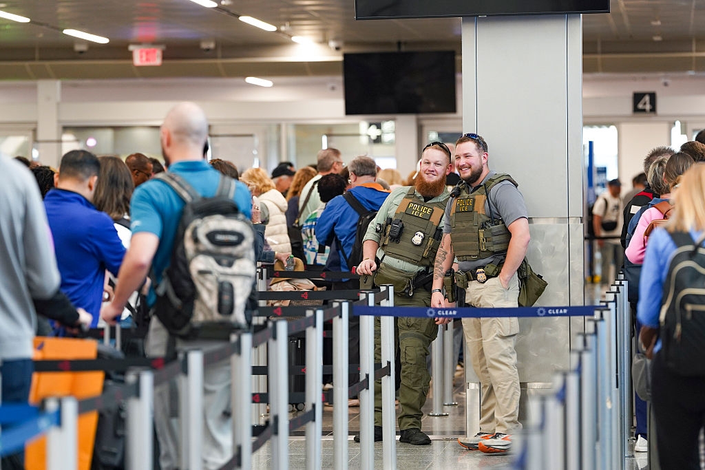 Two information unit grin portion lasting successful a engaged airdrome line