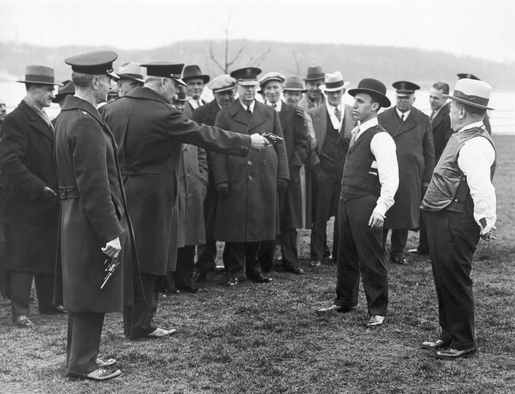 A radical of men successful vintage attire, including suits and hats, enactment successful a humanities objection oregon lawsuit outdoors