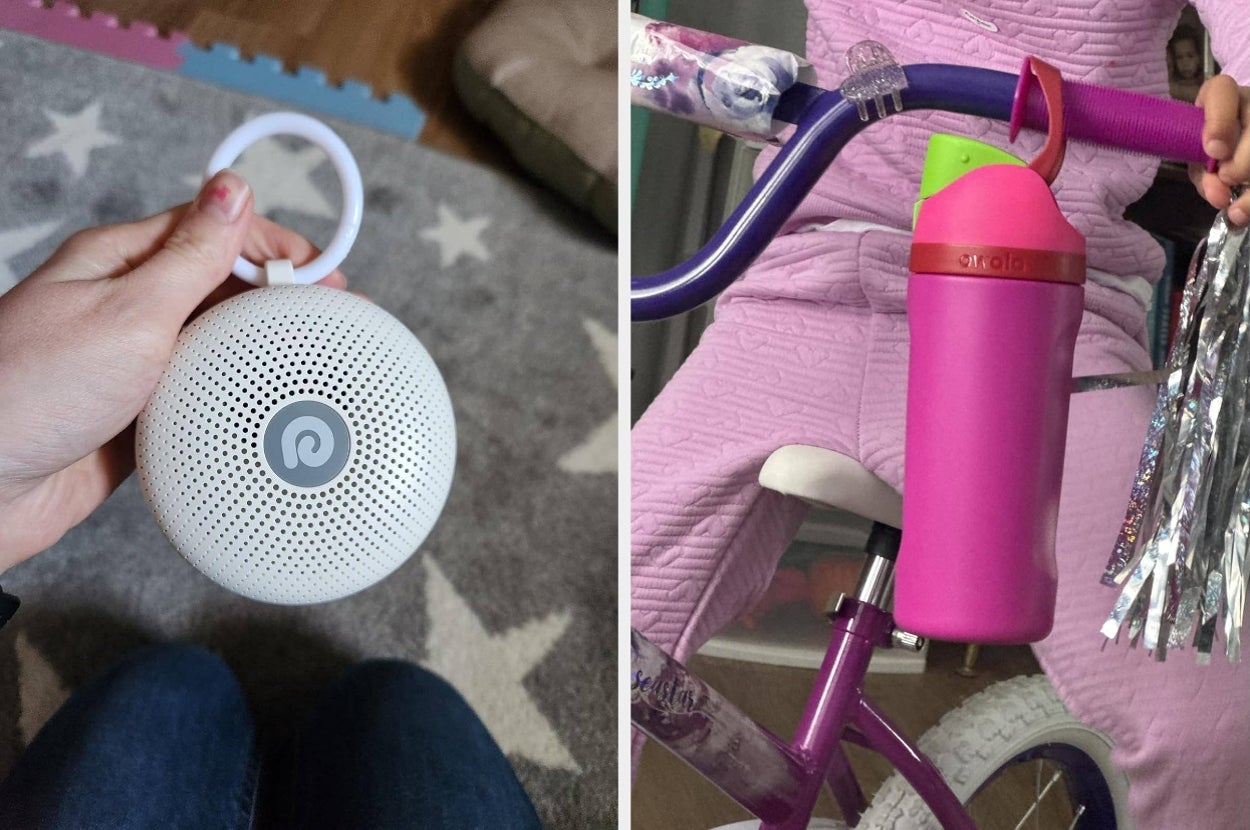 Person holds a portable speaker with a loop, next to a child on a bike with a pink water bottle in the holder