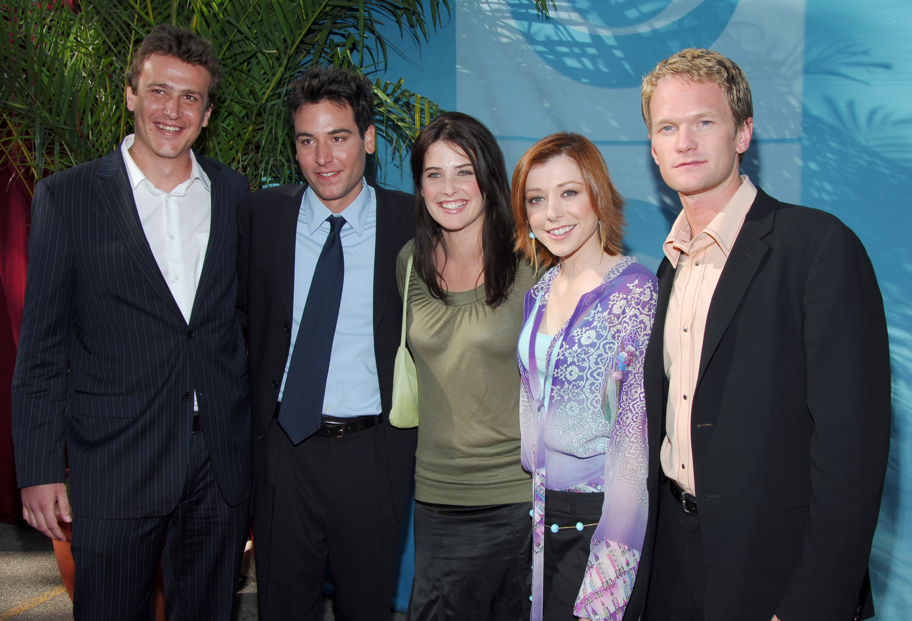 Five radical   lasting  unneurotic  astatine  an event, dressed successful  ceremonial  and semi-formal attire, smiling for the camera