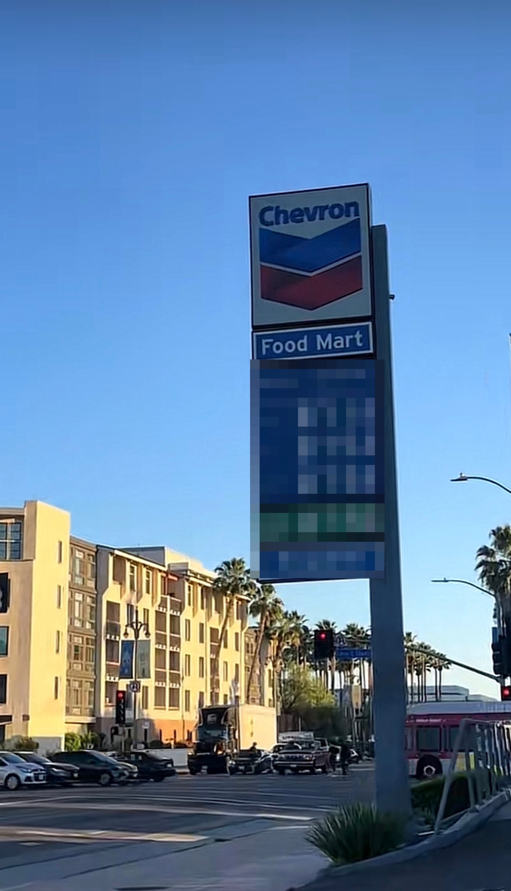 Chevron state  presumption    motion   showing prices for gasoline and diesel fuel. Palm trees and buildings disposable   successful  the background