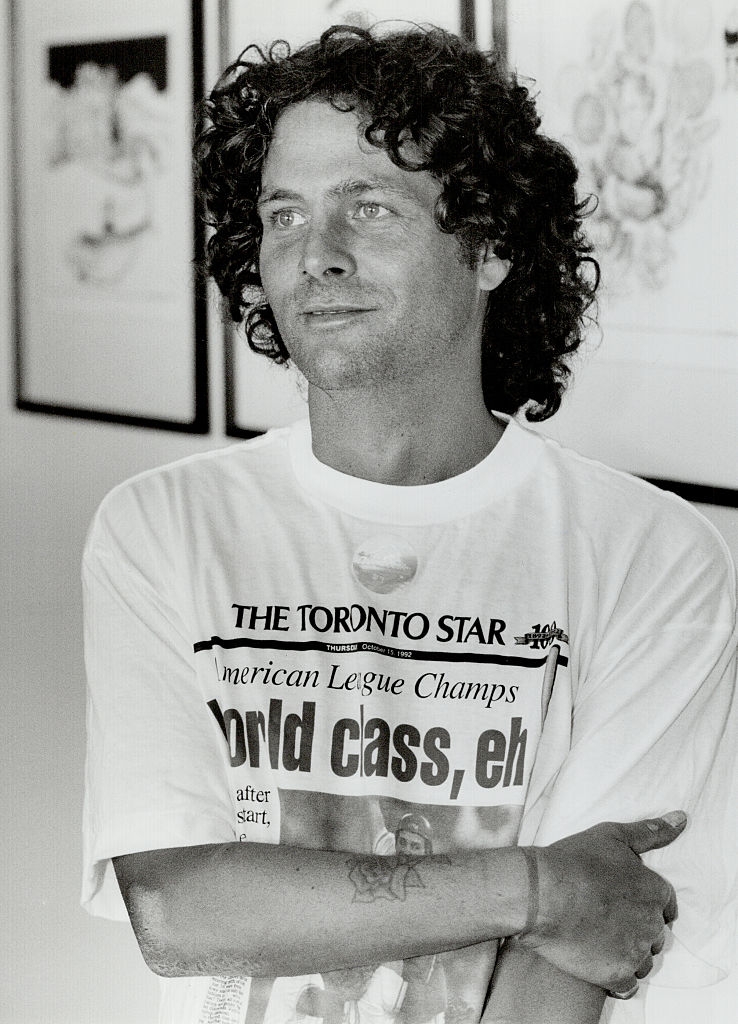 Person with curly hairsbreadth wearing a T-shirt with "The Toronto Star" header astir American League Champs