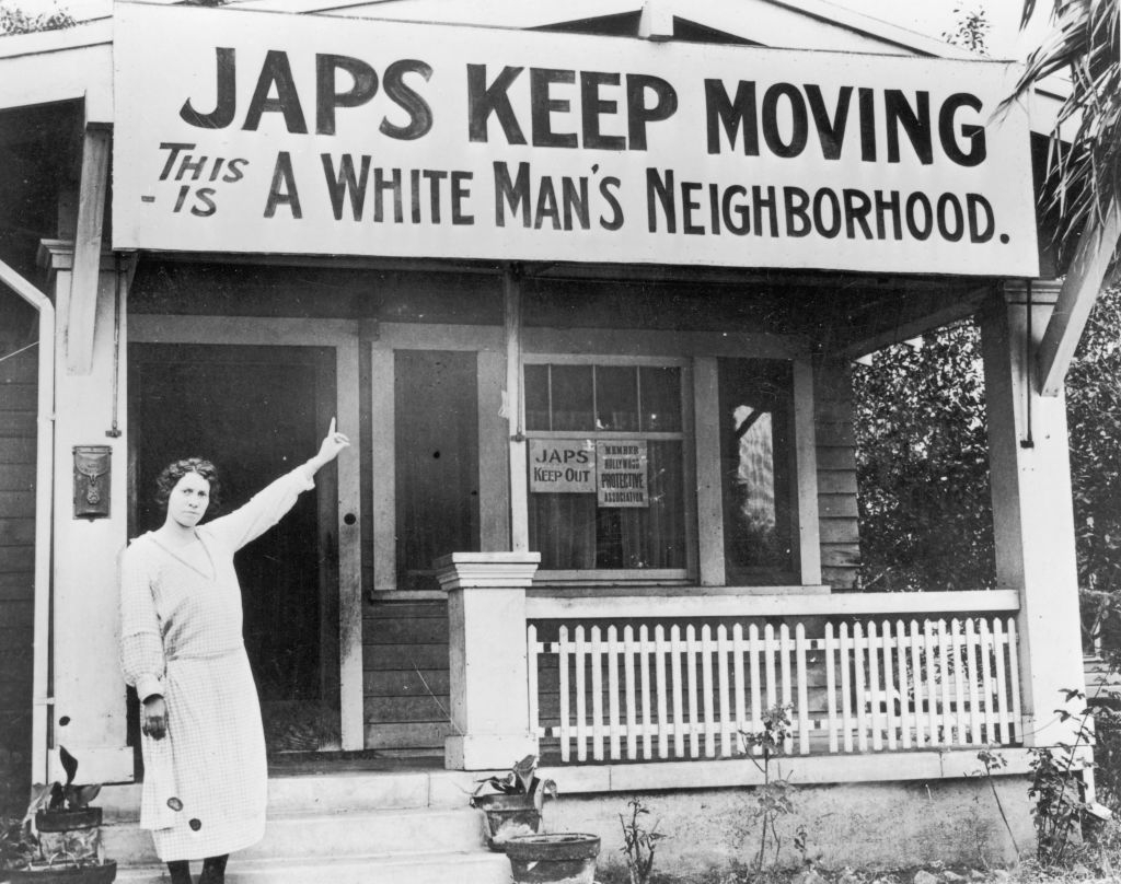 A pistillate points to a ample discriminatory motion connected a location porch, stating "Japs support moving. This is simply a achromatic man's neighborhood."