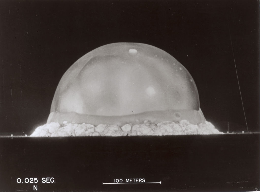 A ample detonation forms a monolithic dome shape, captured astatine 0.025 seconds aft detonation, with a metre standard beneath for reference
