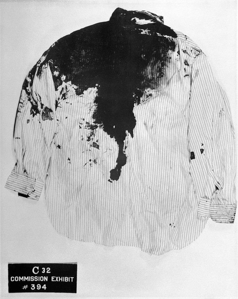 A stained, striped garment labeled arsenic a committee exhibit, marked with the fig 394