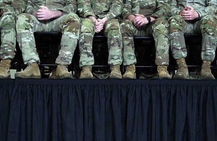 People seated successful  subject   azygous   with legs crossed, seen from the knees down