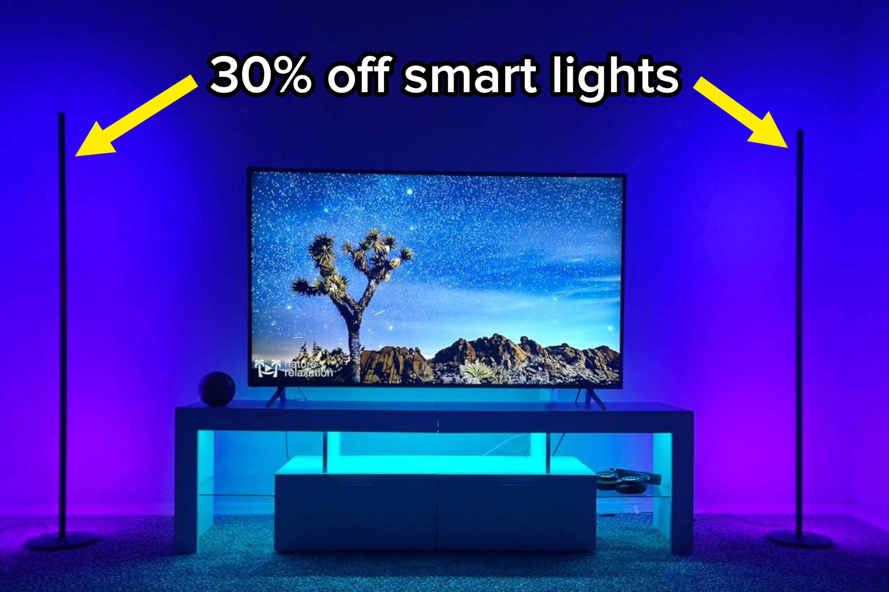 Modern living room setup featuring a flat-screen TV on a sleek stand, ambient lighting enhancing a minimalist decor