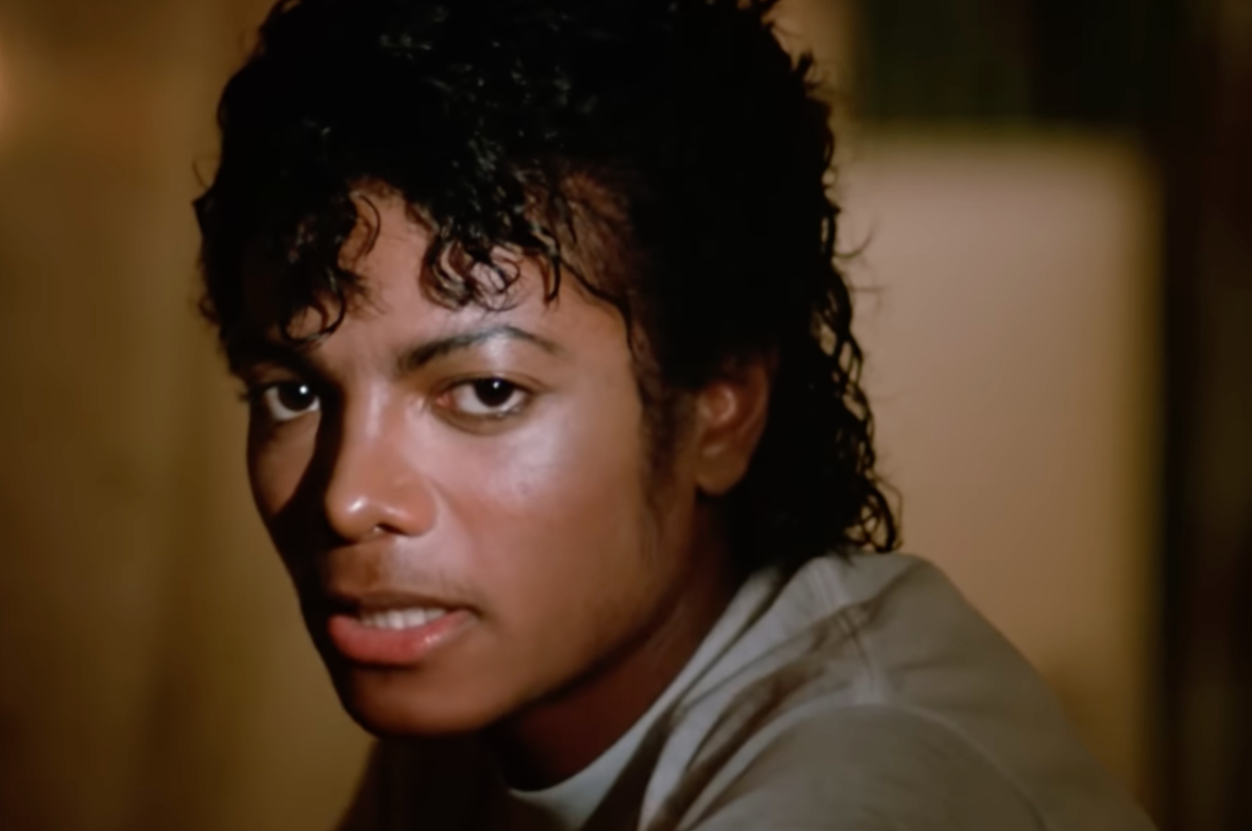 I don't know who this is, but the person is looking at the camera with a serious expression, wearing a casual shirt