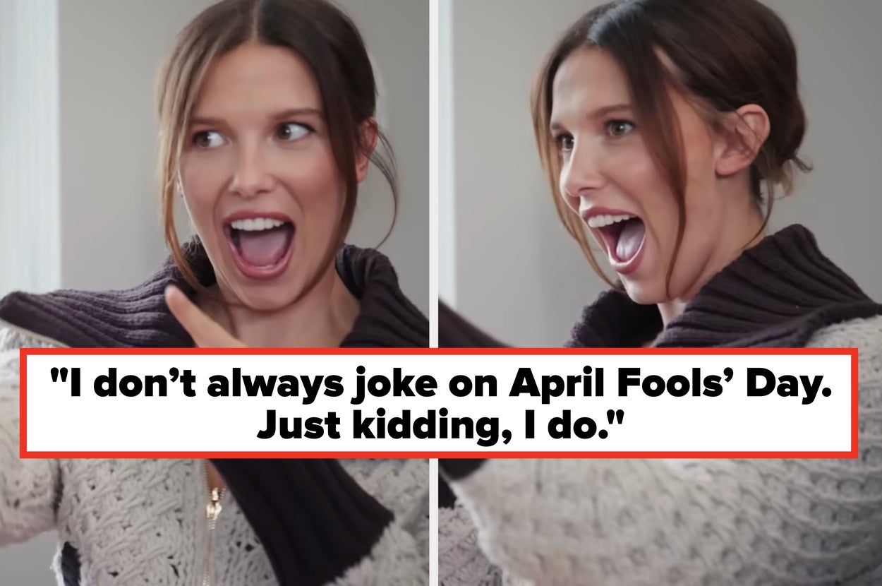 Person joyfully pointing and smiling, wearing a cozy, textured sweater with a large collar