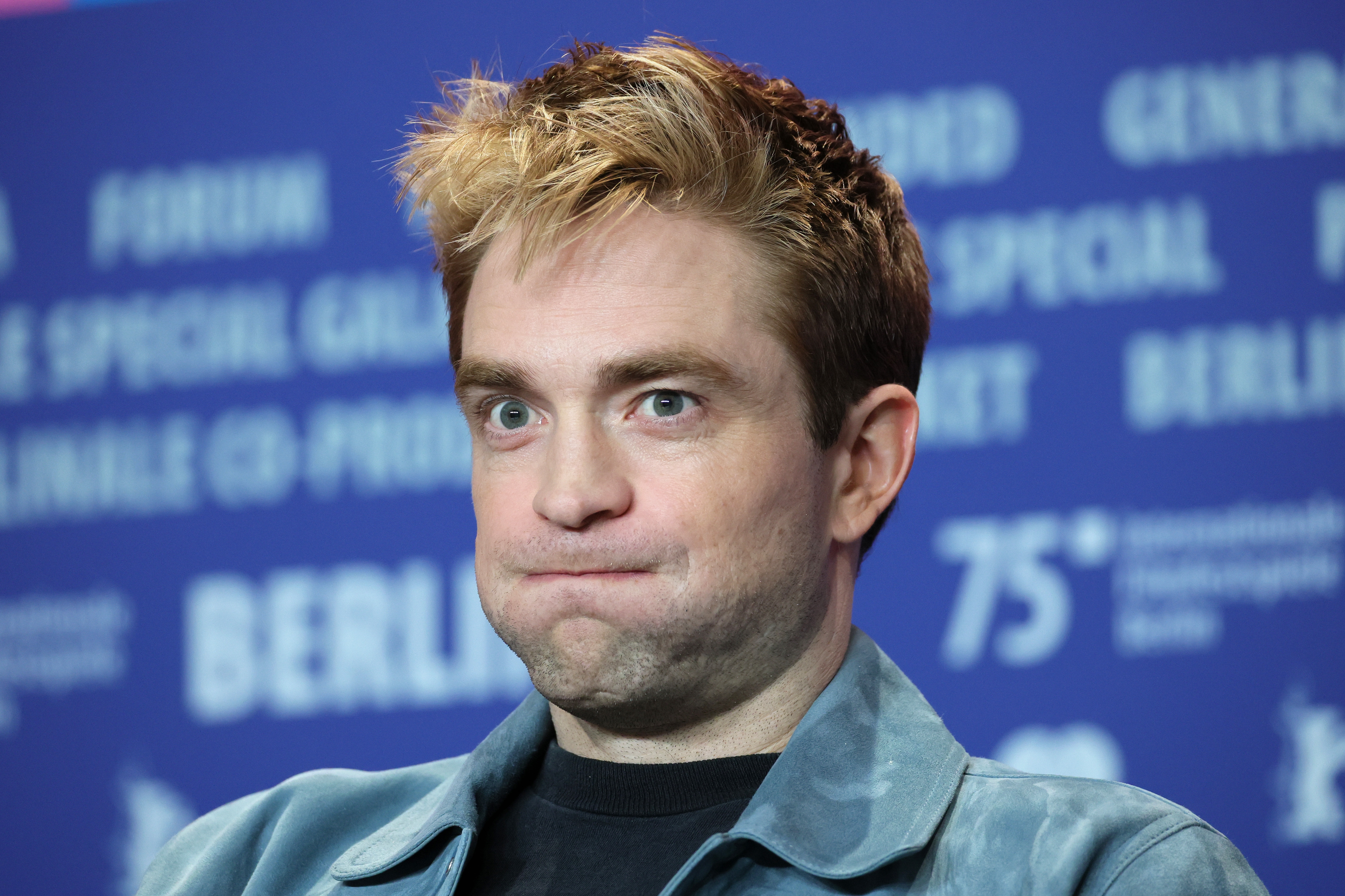 Man with styled hairsbreadth and a neutral look astatine a property event