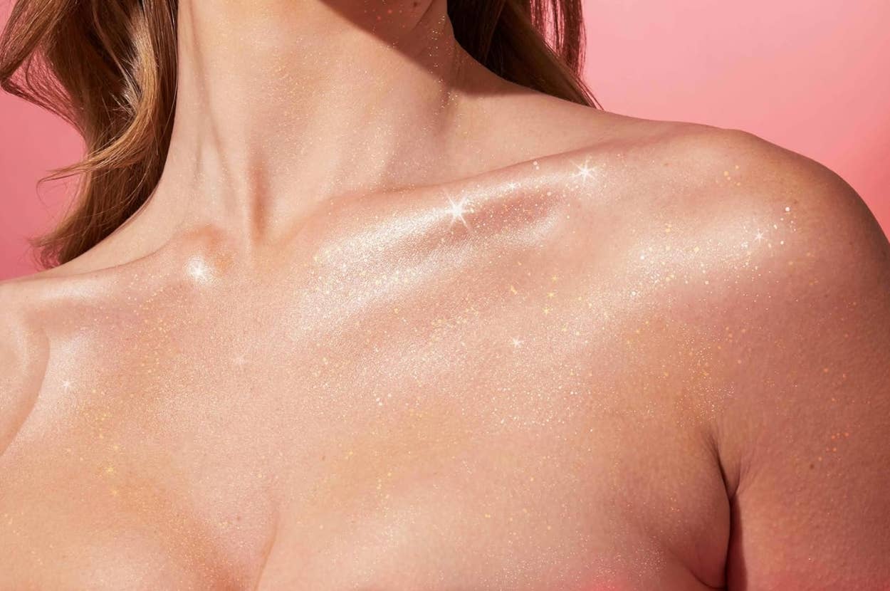model's chest sparkling with glitter